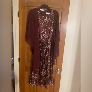 New with tags Tahari mid length dress with wrap. Color is aubergine or eggplant.